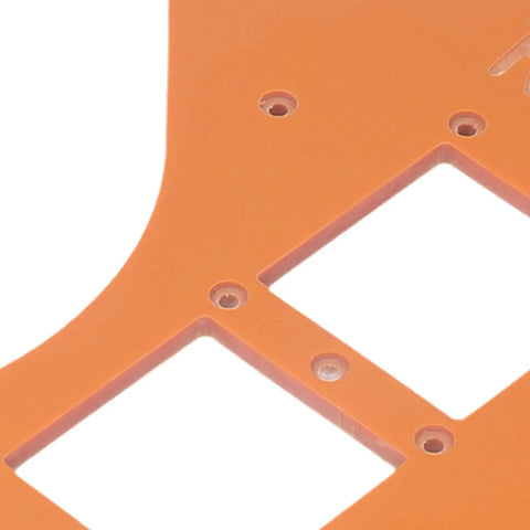 Close-up of orange plastic from the Two Piece Woodworking Corner Radius Template Kit With Router Jig Covering R15 To R200.