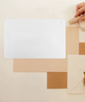 Rigid Self Seal Mailers 90 Pack White Cardboard Envelopes shown with hand holding twine, decorative envelope on beige background
