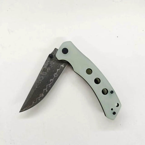 Damascus Pocket Folding Knife With 3.26 Inch Sharp Blade And G10 Handle, open view showing blade texture and handle design