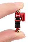 Close-up of a red Beefed Up 43mm Aluminum Threaded Shocks Tele Absorber Upgrade for Axial SCX24 Gladiator Deadbolt C10.