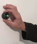Hand using Magnetic Stud Finder No Batteries No Calibration 3X More Reliable For Lath And Plaster And Metal Studs With Visual And Audible Indicator Easy And Fun To Use 1 Inch Magnet on wall