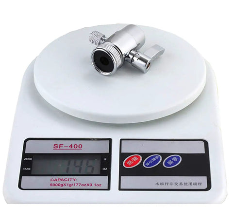 Heavy Duty Brass Sink Faucet Diverter Valve With Rigged Tough Chrome Handle on a scale, showing weight for plumbing use.