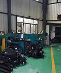 Factory interior with 46-250 Drive Belts for Lathe Type 1 Type 2 Replacement Parts Two Pack, ready to install, stacked on the floor.