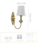 Vintage Wireless Wall Sconce Set Of Two Rechargeable Gold Led Accent Lamps With Fifteen RGB Mood Tones Zero Cord Hassle Super Easy Mount For Living Room Vibe - Detail view of one lamp with white shade.