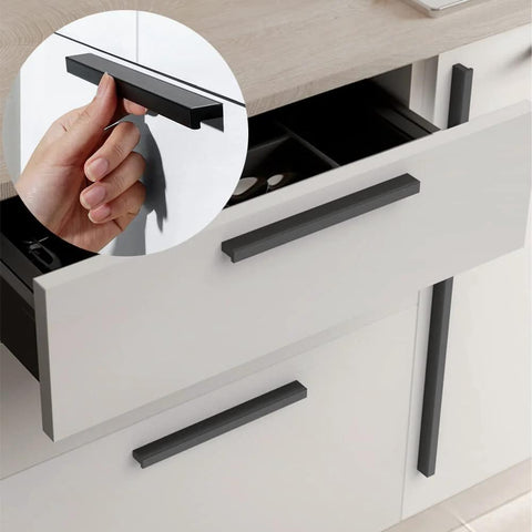 Installed Black Tilted Aluminum Cabinet Handles 12 Pack 5 Inch 128mm Hole Centers on kitchen drawer with a hand pulling