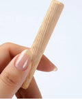 Hand holding a grooved wooden dowel, part of the 21 Pieces Hardwood Grooved Wooden Dowels Assorted Sizes M6 M8 M10 set for carpentry projects.