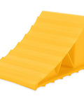 Camco wheel chock, yellow plastic ramp-style chock, angled view for trailer or RV
