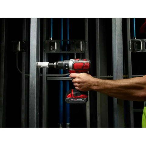 Badass Compact Cordless Drill Driver Kit Featuring Brushed Motor And High Torque Performance Designed For Serious Projects With Two Speed Settings And Heavy Duty Metal Chucks Built To Handle Daily Construction Tasks Without Breaking A Sweat, being used on metal framing.