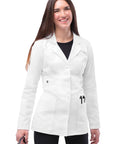Woman wearing Universal Stretch Lab Coat For Women, 28 Inch Tab Waist Medical Coat, White, Size M, holding stethoscope