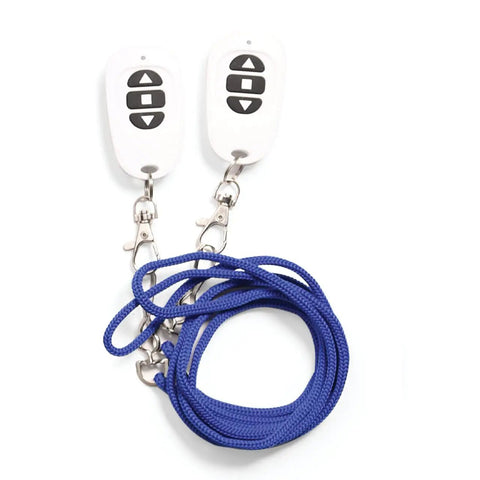 Two remote controls with black buttons attached to blue rope leashes on a white background