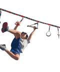 Child playing on Ninjaline 36 Foot Intro Kit With Seven Hanging Attachments, outdoor ninja obstacle course for kids.