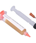 10cc Solder Flux Paste For Easy Tinning And Strong Joints syringe with needle, Model RMA-UV-559, shown with cap and applicator