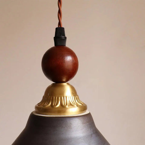 Top view of DWEIHDV Ceramic Wall Sconce Vintage Gold Wall Light Fixture showing brass and wooden details.