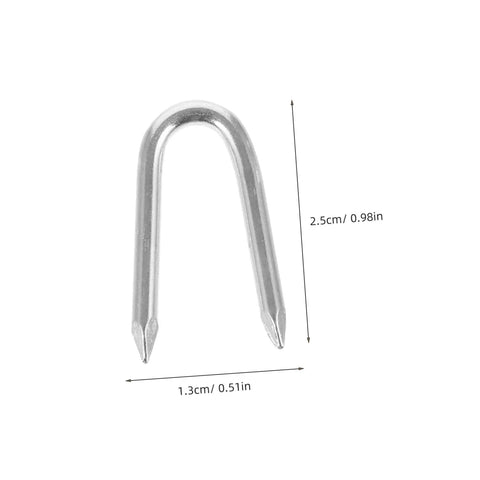 Silver iron U-shaped fencing staple with sharp tips, dimensions 2.5cm x 1.3cm, part of 50 Piece U Shaped Fencing Staples For Heavy Duty Iron Garden Nails Quick Install Sharp Tip Easy To Use For Securing Fences Tents And Landscaping For Outdoor Projects And DIY Fencing.