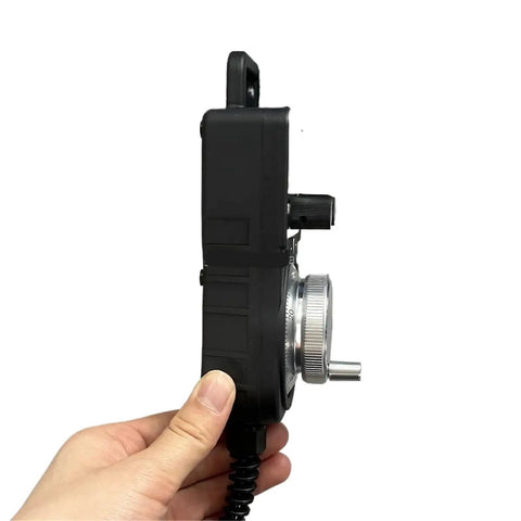 Heavy Duty Universal 4 Axis Cnc Pulse Generator Mpg Handwheel For Manual Control Machine And Precision Milling Jobs Total Slang, side view held in hand