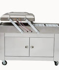 Heavy Duty Double Chamber Vacuum Sealer with stainless steel finish, ideal for sealing meat, seafood, and veggies.