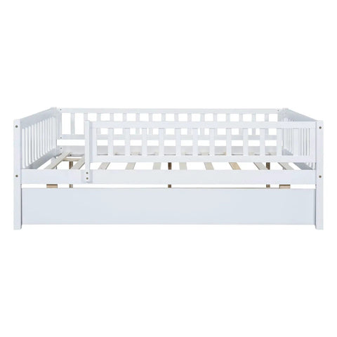 Front view of Full-Size Wood Daybed With Trundle And Fence Guardrails In White Finish showing sturdy pine frame and slatted base