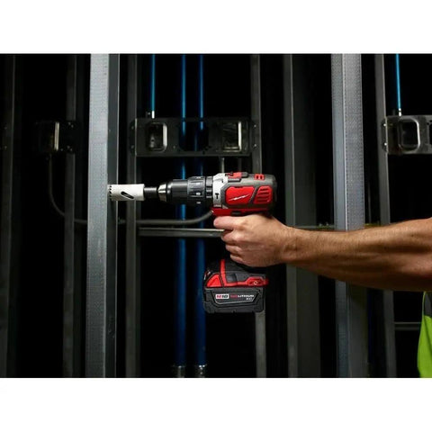Heavy Duty Compact Hammer Drill Driver With All Metal Chuck And Gears Delivers Hella Tough 500 Inch Pounds Torque For Concrete And Wood Jobsites Worldwide For Pro Contractors in use, drilling through metal framing.