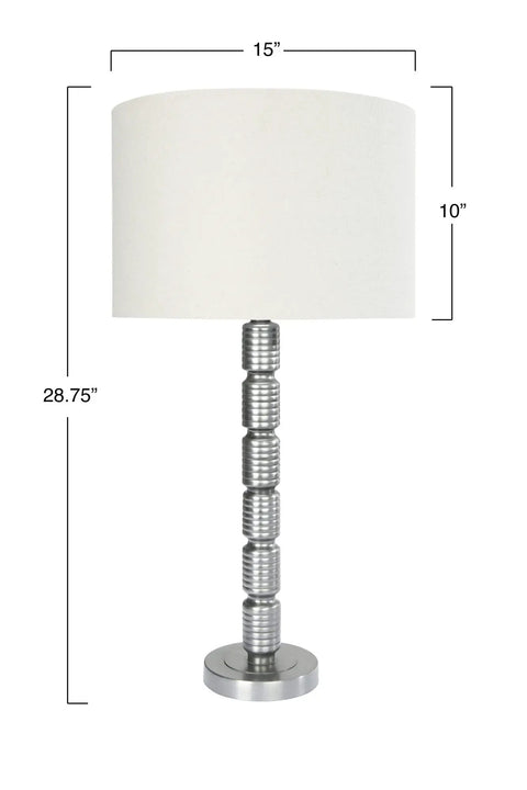 Table lamp with metal stacked column base and cream drum shade, similar design to Faceted Metal Floor Lamp With Stacked Column Base.