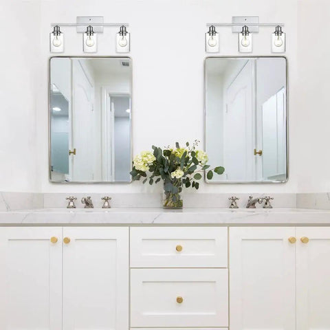 Three Light Chrome Vanity Wall Light With Clear Glass Shade For Modern Bathrooms And Powder Rooms above mirrors in bathroom