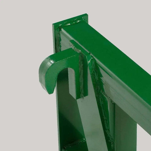 Close-up of Euro Global Hay Frame With 49 Inch Spear And Stabilizers For John Deere Tractors, showing green mounting detail.