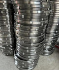 Heavy Duty Flat Steel Drain Cleaning Tape 2000 Cm Long stacked rolls of manganese steel for sewer clog removal.