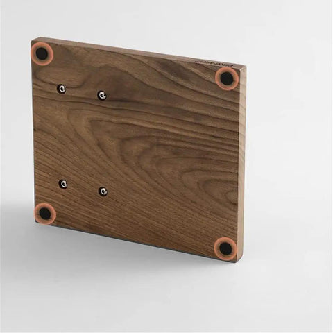 No Fuss 58mm Walnut Wood Espresso Tamper Station showing the sturdy base with rounded edges and mounting holes for secure countertop use.
