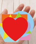 Hand holding Color Coded Shape Pattern Play Cards Set For Fun Hands On Math And Craft Activities With Eight Geometric Patterns