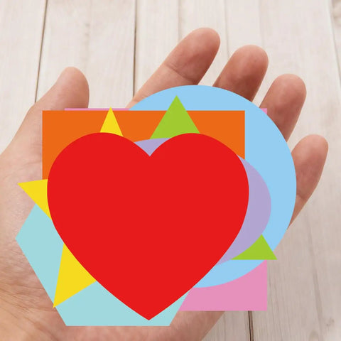 Hand holding Color Coded Shape Pattern Play Cards Set For Fun Hands On Math And Craft Activities With Eight Geometric Patterns