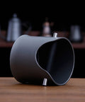 Heavy Duty Shock Absorbent Coffee Knock Box For Espresso Machines With Deep Spill Safe Bowl and Non Slip Grip angled view showing durable ABS structure