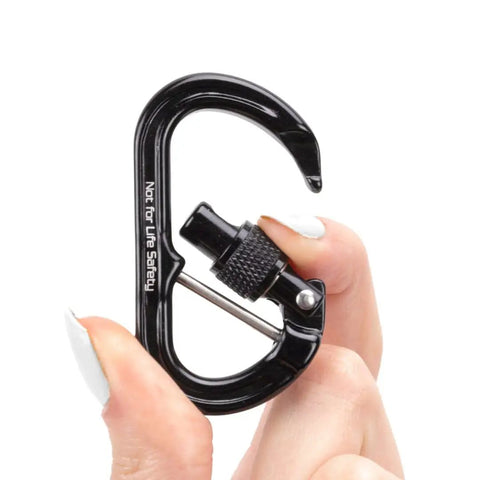 Micro Raider Captive Aluminum Keylock Screw Lock Carabiner held in hand, showcasing black finish and locking mechanism, compact size.