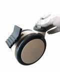 5 Inch Medical Caster Wheels With M12x25 Screw Bearing Brake, side view, held by hand, for hospital cart and hospital bed.