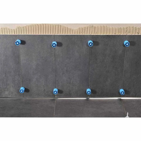 Proleveling System 1/32 Inch Extra Linear Leveler Stems Pack Of 100 for tile installations on a dark tile wall with blue stems