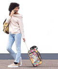 Woman pulling colorful underseat carry on rolling bag for women, 15 inch lightweight weekender luggage with two smooth wheels, outdoors