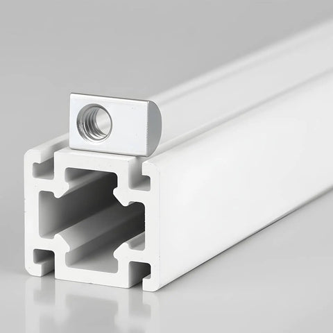 Close-up of 1/4-20 T Slot Nut with Ball Spring on aluminum extrusion rail for CNC DIY, carbon steel, silver finish, solid fit.