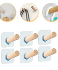 6 Piece Extra Long Wooden Wall Hooks Self Adhesive Coat Rack For Doors Easy Peel Stick mounted on a wall holding various coats.