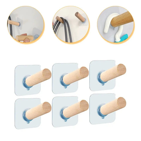 6 Piece Extra Long Wooden Wall Hooks Self Adhesive Coat Rack For Doors Easy Peel Stick mounted on a wall holding various coats.