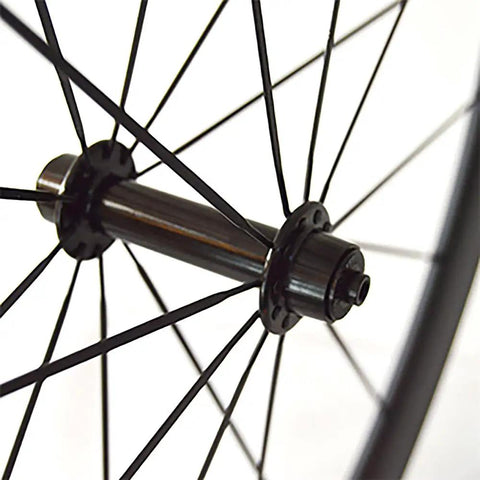 Close-up of 700C Carbon Fiber Road Wheelset With Alloy J Bend Hub And Beefy Aero Spokes For Tubular Clincher Or Tubeless Rims