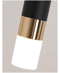 Close-up of a wall sconce showcasing black and gold details of a matte acrylic shade. Upgrade Your Hangout With These Top Tier Wall Sconces And Hanging Wire Lamp Pair Offering Glare Free Led Lighting For Chill Living Room Or Bedroom Setup In Warm White Matte Acrylic Shading.