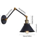 Heavy Duty Industrial Swing Arm Wall Sconce Built Tough For Living Spaces Vintage Metal Light Fixture with adjustable arm and black finish.