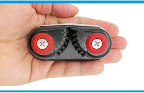 Hand holding 2 Pack Aluminum Kayak Cam Cleats For Kayak Boat Canoe And Dinghy Fast Entry Rope Cleats 15mm Capacity