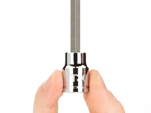 Close-up of hand holding a chrome Torx bit socket from the Three Eighths Inch Drive Torx Bit Set With External Star Sockets And Case.