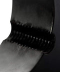Close-up of Industrial Bushing For Heavy Duty V Belt Pulley With Dual Grooves, 85.5 Diameter, black cast iron texture detail.