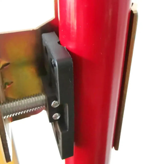Close-up of Rock Solid Laser Level Bracket for Telescoping Poles, black mount fitting onto a red pole for secure use.