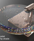 Close-up of VCDUXMQLK Nordic Luxury Crystal Bedroom Wall Lamps LED Light Source lamp shade with bubbles and reflections.