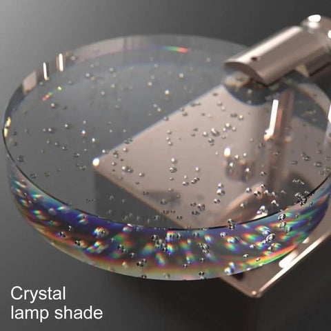 Close-up of VCDUXMQLK Nordic Luxury Crystal Bedroom Wall Lamps LED Light Source lamp shade with bubbles and reflections.