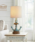 Anchor Accent Lamp With Cozy Coastal Vibe In Antique Iced Blue Resin Anchor Base Easy On Off Push Through Switch Nautical Decor Lighting For Living Room Bedroom Or Desk on a side table with a sofa