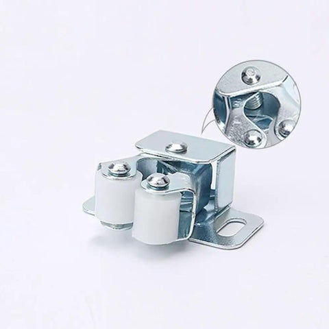 Four Piece Cabinet Door Catches Featuring Bulletproof Magnetic Dampers And Adjustable Metal Mounts For Kitchens And Wardrobes With A Dead Simple Install That Delivers Slick Soft Close Action Every Time - close-up of metal catch with rollers.