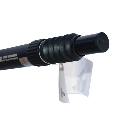 Close-up of 27.2mm Suspension Seatpost Shock Absorber for Road Bikes with coil spring and tag, black aluminum