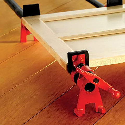 Two red Bessey BPC-H34 3/4-in H-style pipe clamps securing a wooden frame.